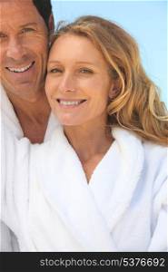 couple on vacation wearing bathrobes