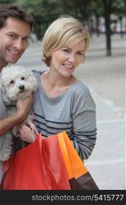 Couple out shopping with dog