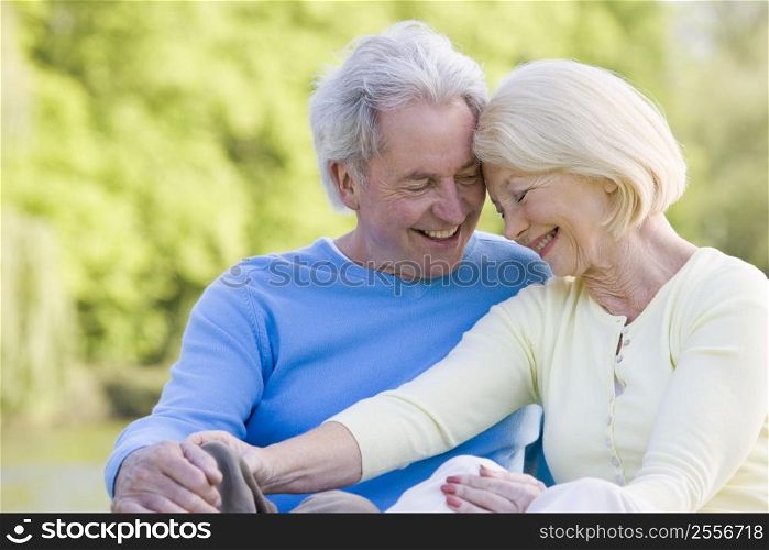 Couple outdoors laughing