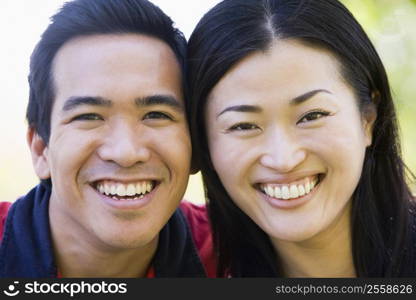 Couple outdoors smiling