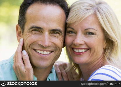 Couple outdoors smiling