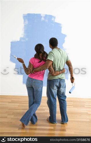 Couple painting room blue