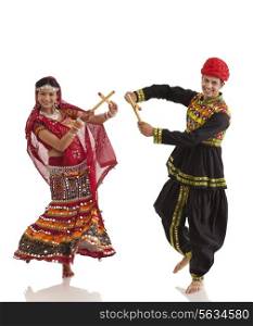 Couple performing dandia dance