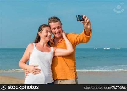 couple photographed in memory on the background of the sea
