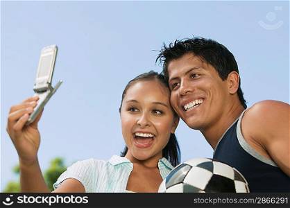Couple Photographing Themselves with Cell Phone