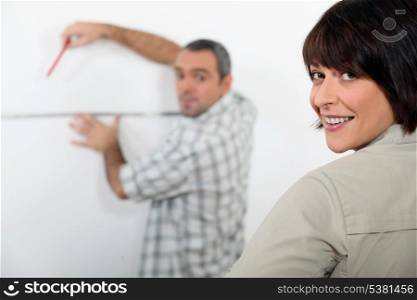 couple planning improvements in their apartment