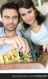 couple playing chess