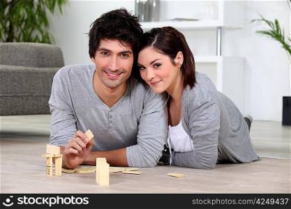 Couple playing dominoes