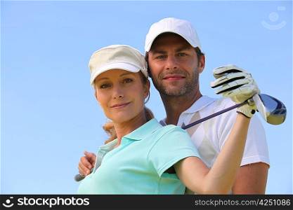 Couple playing golf