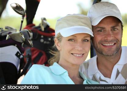 Couple playing golf