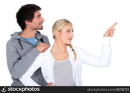 Couple pointing object
