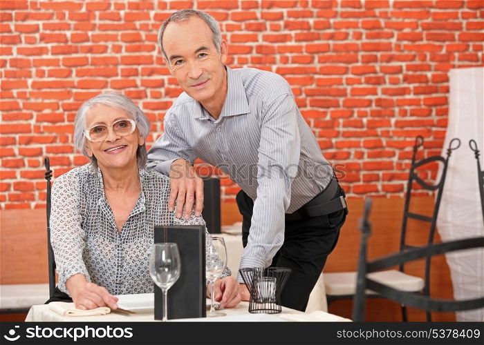 Couple posing in a restaurant