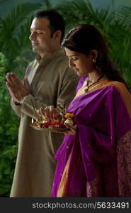 Couple praying during diwali