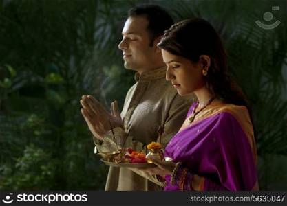 Couple praying during diwali