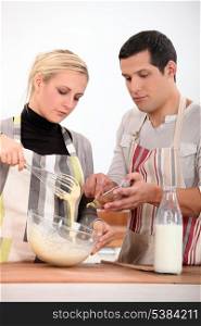 Couple preparing recipe
