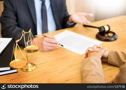 couple problems sitting a marriage Golden wedding rings judge gavel deciding on marriage divorce signing divorce documents or premarital agreement provide legal advice of lawyer and consoling to his clients