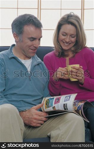 couple reading a magazine together