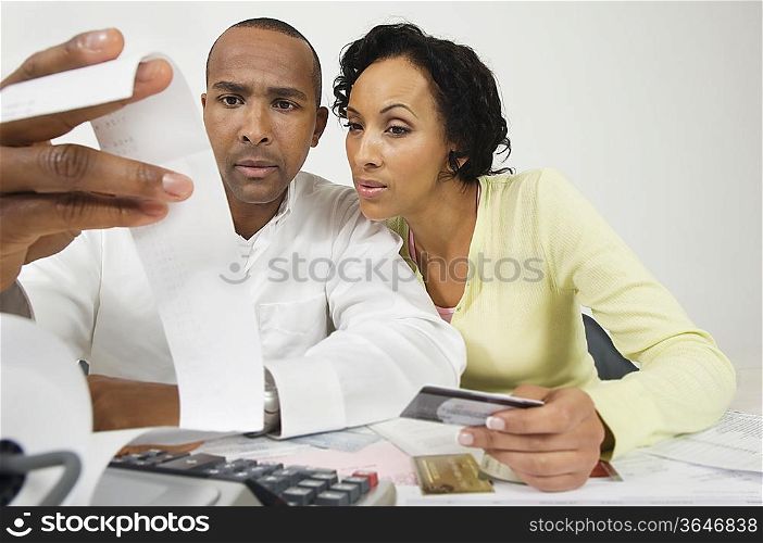 Couple Reading Adding Machine Tape