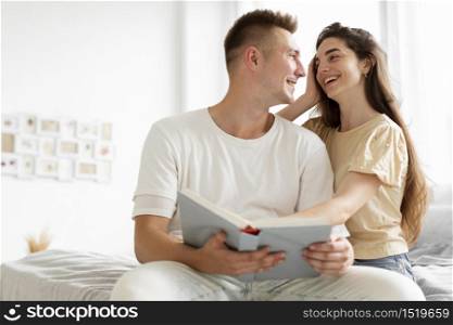 couple reading book together