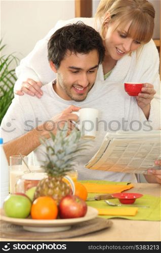 Couple reading the newspaper