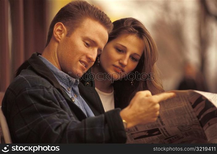Couple Reading the Newspaper Together