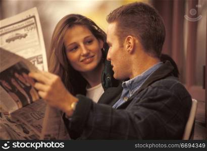Couple Reading the Newspaper Together