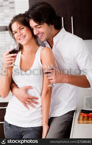 couple ready to drink their wine in kitchen