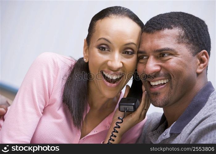 Couple receiving a good news phone call from clinic