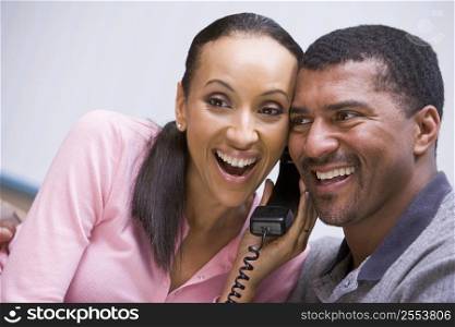 Couple receiving a good news phone call from clinic
