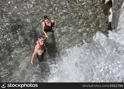 Couple Refreshing in Natural Pool