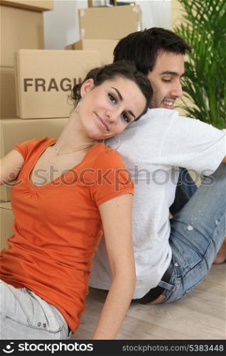 Couple relaxing after moving house