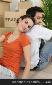 Couple relaxing after moving house
