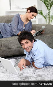 Couple relaxing at home on a Sunday