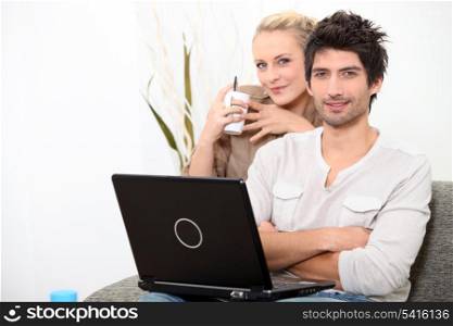 Couple relaxing at home on a Sunday morning