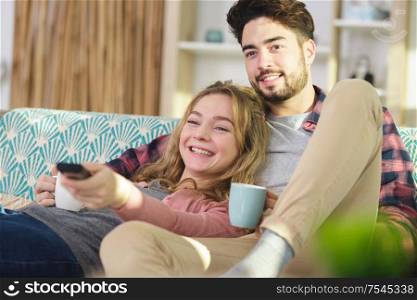 couple relaxing during home renovation having a coffee break