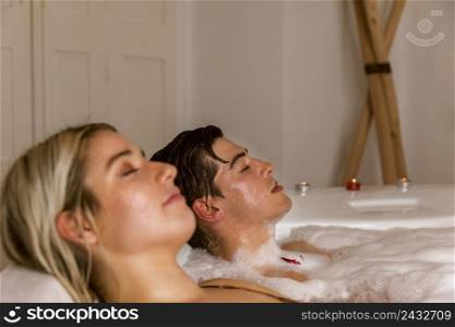 couple relaxing hot tub