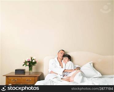 Couple relaxing in bed