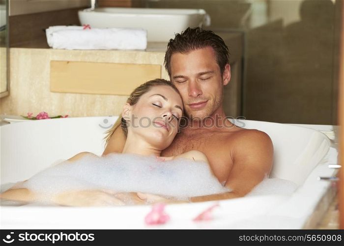 Couple Relaxing In Bubble Bath Together