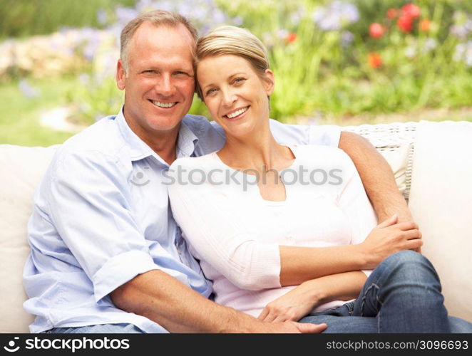 Couple Relaxing In Garden