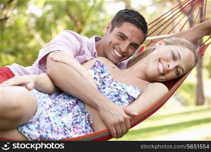 Couple Relaxing In Hammock