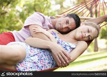 Couple Relaxing In Hammock