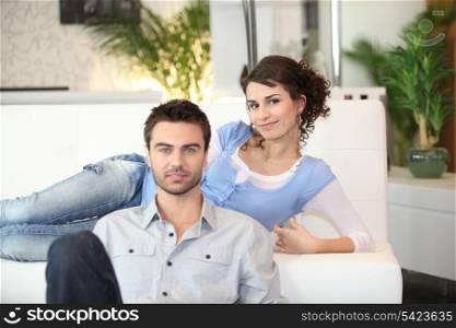 Couple relaxing in living room