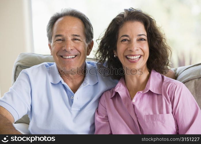 Couple relaxing in living room and laughing