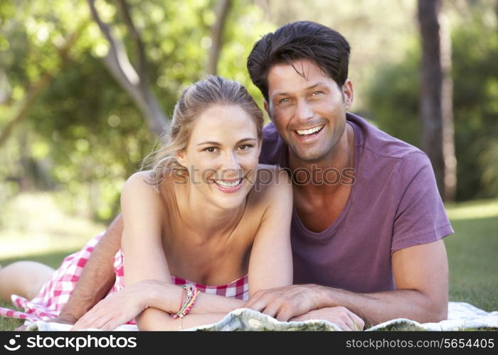 Couple Relaxing In Park Together