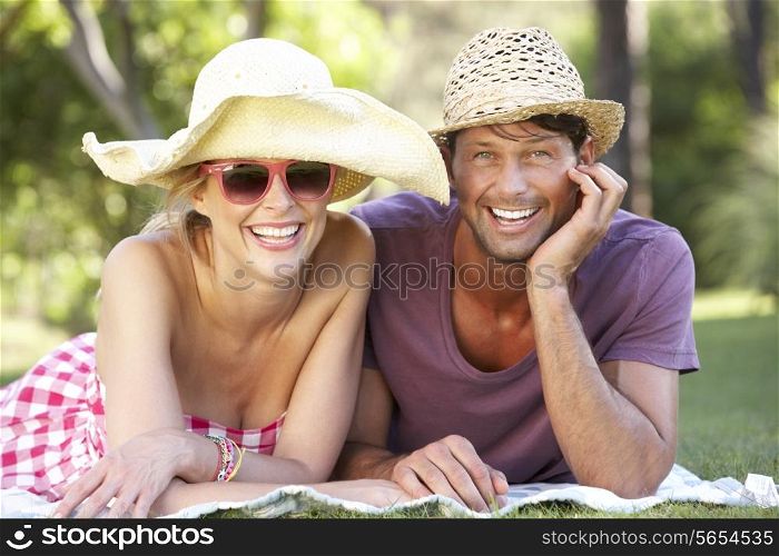 Couple Relaxing In Park Together