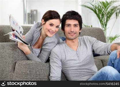 Couple relaxing in their living room