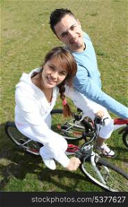 Couple relaxing on a bicycle