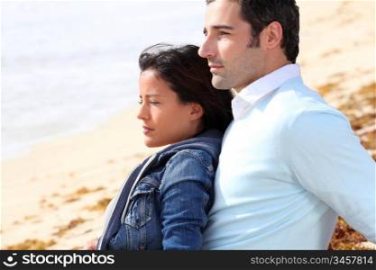 Couple relaxing on a sandy beach
