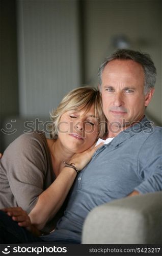 Couple relaxing on a sofa
