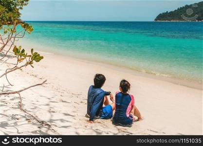 Couple relaxing on beach summer holiday